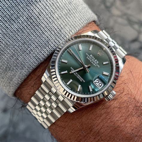 green and silver rolex